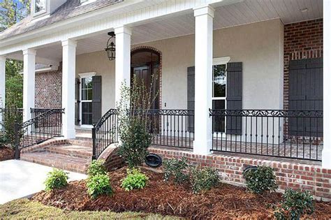 White wrought iron porch railing, costly as wrought iron galvanized iron entry doors walk. Willow Bend, Lot 52 in 2020 | Brick porch, Wrought iron ...