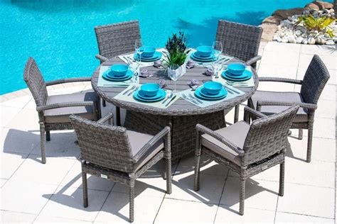 At your doorstep faster than ever. Tuscany 7 Piece Round Outdoor Dining Table Set in Gray ...