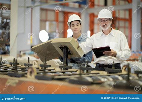 A New Generation Of Engineers In A Metal Sheet Factory Studying Work