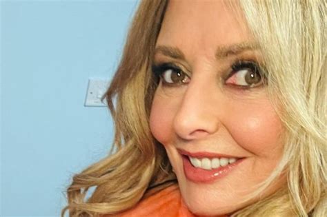 Carol Vorderman Looks Incredible As She Shows Off Her Curves In See Through Red And Orange Dress