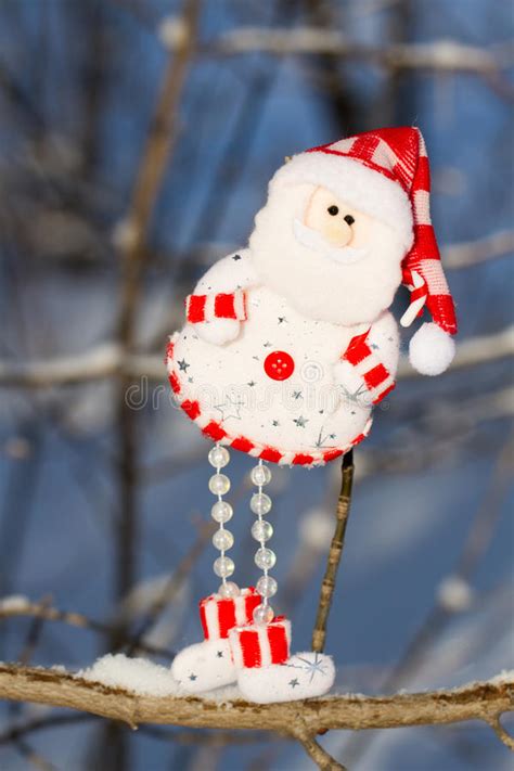 One Fun Snowman Santa Claus Hanging On A Branch Stock Image Image Of
