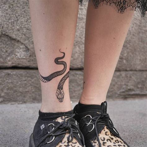 Snake Tattoo On The Right Ankle