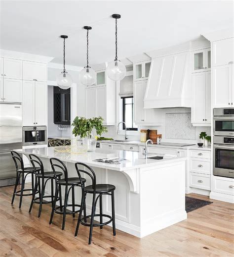 White Shaker Center Island With Black Bentwood Stools Transitional