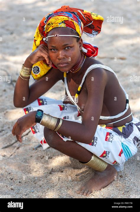 Portrait Of A Mucubal Tribe Young Woman Wearing A Colorful Headwear Namibe Province Virei
