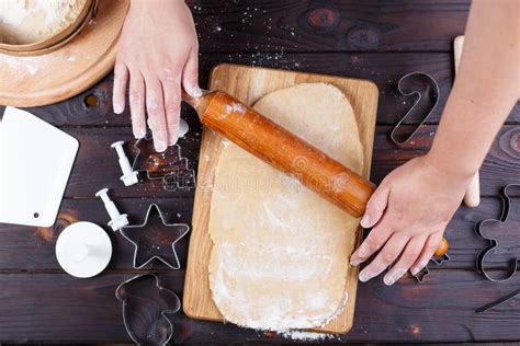 Gingerbread Making Woman Rolling The Dough With Rolling Pin On Stock
