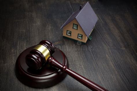 Real Estate Auction Gavel And House On Dark Wooden Background Stock