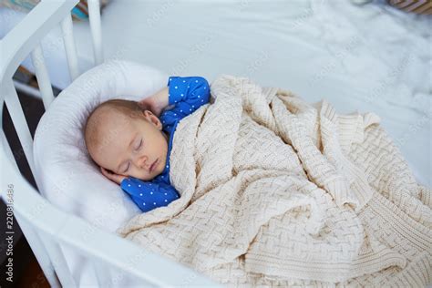 Adorable Baby Girl Sleeping In The Crib Stock Photo Adobe Stock