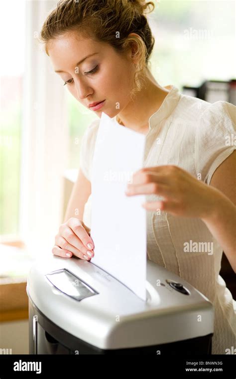 Woman Shredding Paper Stock Photo Alamy