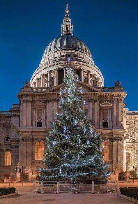 A Large Christmas Tree Is Lit Up In Front Of The Dome Of St Pauls