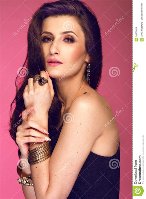 Portrait Of Woman With Long Brunette Curly Hair Studio S Stock Photo