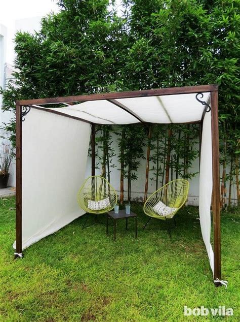 There are eye hooks mounted on the frame of the panels, and the wire cable slides through the hooks, over the top of the panel. 16 Easy DIY Backyard Sun Shade Ideas for your Backyard or ...