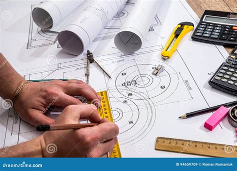 Mechanical Engineer With Work At Technical Drawings Stock Image Image