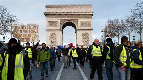 ‘yellow Vests Descend On Paris As Police Arrest Hundreds And Fire Tear