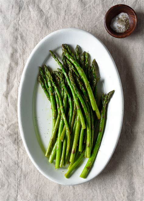 Sauteed asparagus, a delectably delicious veggie side dish. Quick & Easy Garlic Sauteed Asparagus - Fork Knife Swoon