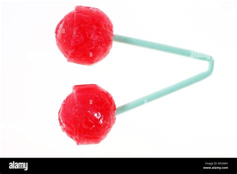 Two Hard Red Sugar Candy Cherry Lollipops On One Folded Stick A Sucker Made To Look Like Two