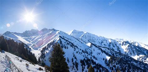 Panorama Of Winter Snowy Mountains Valley With Sun In Ak