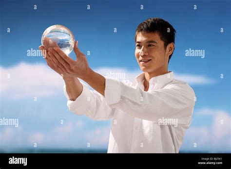 Man Holding Crystal Ball Stock Photo Alamy