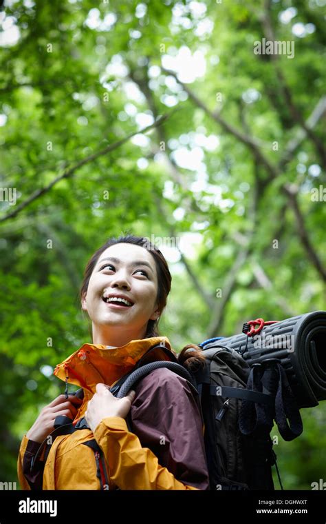 A Woman Hiking In The Woods Stock Photo Alamy