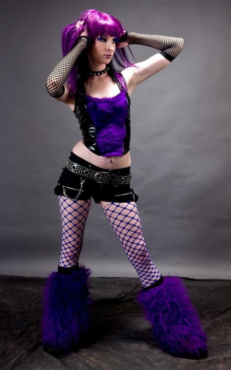 Purple Haired Gothic Girl Wearing Blue Fishnet Pantyhose And Black Shorts