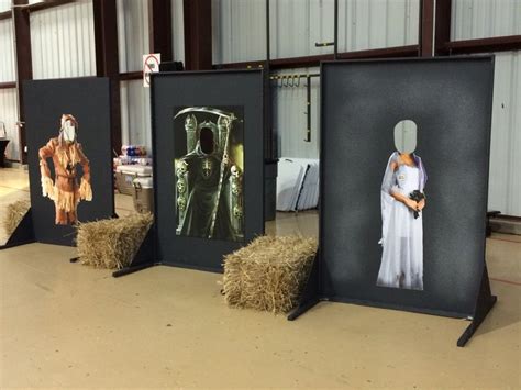 Some Hay Bales Are Sitting In Front Of Three Pictures And One Is