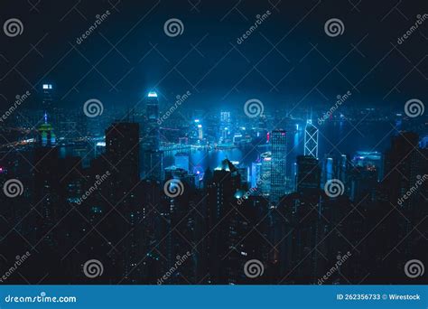 Aerial Shot Of A Modern City With Skyscrapers Illuminated With Blue