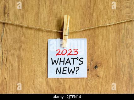 2023 What Is New Symbol White Paper With Words 2023 What Is New Clip On Wooden Clothespin Beautiful Wooden Background Business And 2023 What Is Ne 2jtfn14 