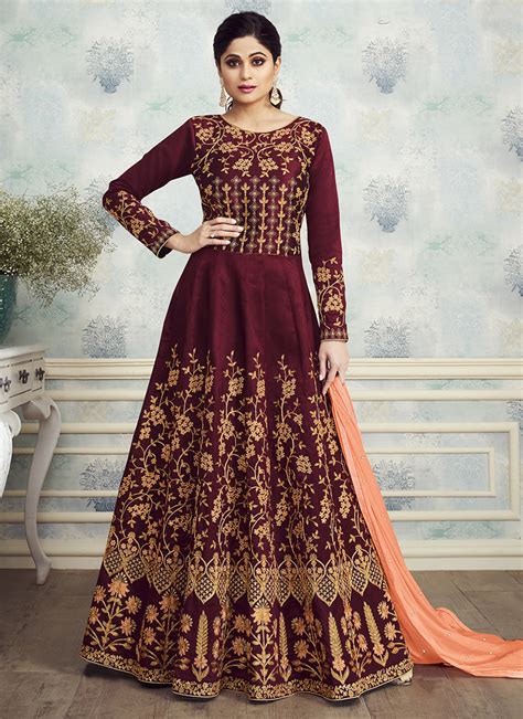 The craze of maxi will never go to end soon. Shop Celebrity style Indian silk maroon anarkali party wear gown dress online