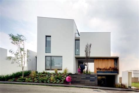 The exterior of a modern style home usually makes use of concrete or stone with wood accents. Modern L-shaped residential building - When merging indoor ...