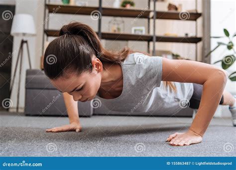 Selective Focus Of Concentrated Sportswoman Doing Push Ups Stock Image Image Of Athletic