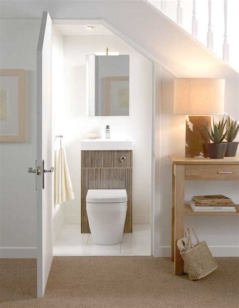 One way that you can do to get around this problem in the bathroom under the stairs is to install a mirror on several sides of the wall. Built-in toilets and bathrooms under staircases
