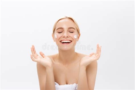 Close Up Beauty Portrait Of A Laughing Beautiful Half Naked Woman Applying Face Cream Isolated