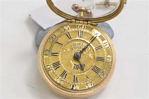 An Early 18th Century Gold Repousse Pair Cased Pocket Watch By C