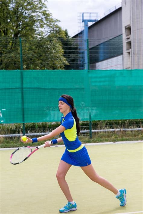 Young Attractive Female Tennis Player Wearing A Sportswear Playing