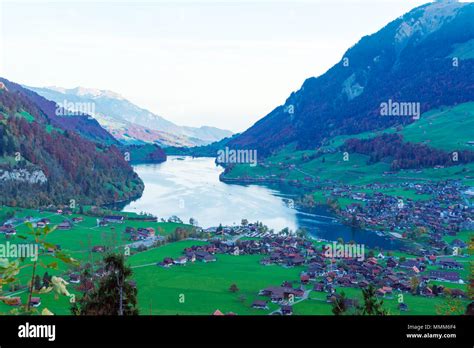 Valley Of Lake Lungern Or Lungerersee With Traditional Alps Chalets In
