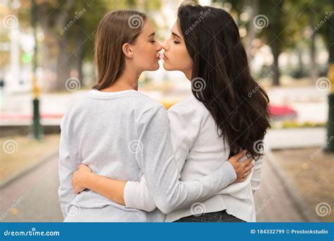 Lesbian Couple Of Girls Kissing Having Date Outdoor Back View Stock Image Image Of Kiss