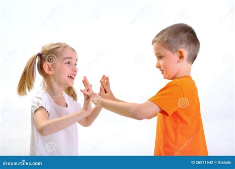 Boy And Girl Pushing With Hands Stock Photo 26571642