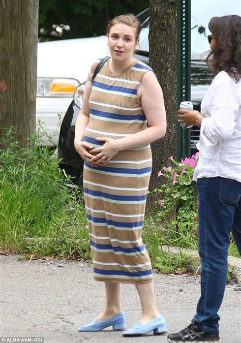 Lena Dunham Accentuates Her Fake Baby Bump In Stripes As She Cradles