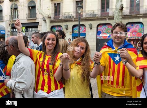 Catalan Young People With The Pattern Of The Independence Flag On The