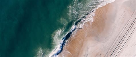 Download Wallpaper 2560x1080 Ocean Aerial View Surf Sand Foam