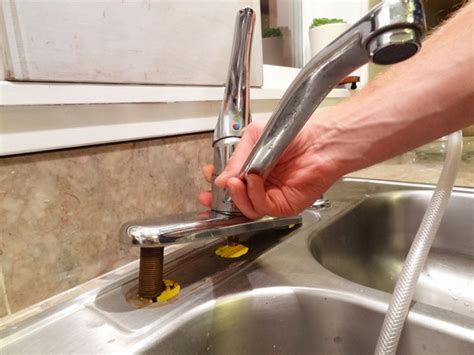 Place a shallow pan or bucket underneath the sink to catch any water. How To Replace Your Kitchen Sink Faucet