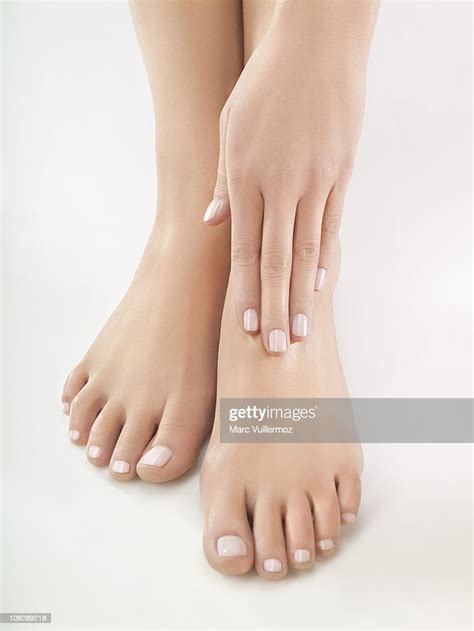Woman Rubbing Her Foot Closeup Photo Getty Images