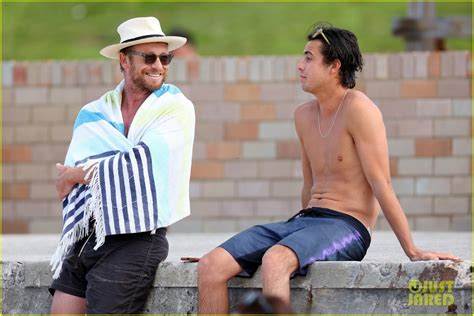Simon Baker Goes Shirtless During Beach Day With 22 Year Old Son Claude See Photos Photo