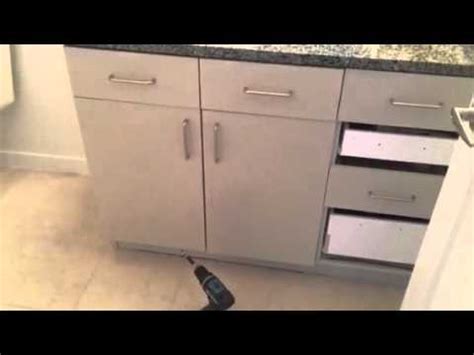 Press the brush against the side of the can to remove excess primer. Cabinet Refinishing - YouTube
