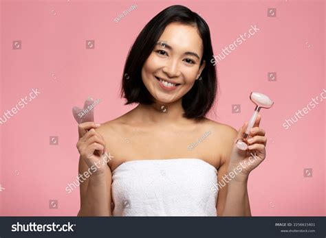 Beautiful Naked Asian Woman Choosing Between Stock Photo 2256615401