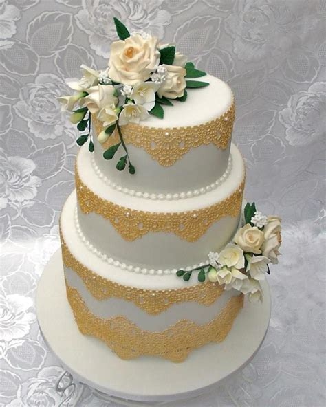 3 Tier Wedding Cake With Gold Edible Lace And Hand Made Sugar Flowers
