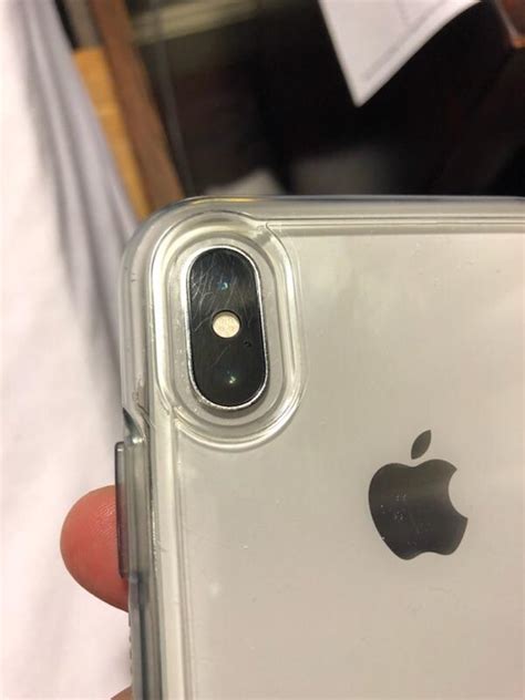 Anyone with what looks like scratches on camera lens?? : r/iphone