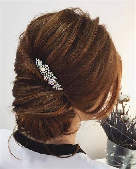 This hairstyle from blogger negin mirsalehi. This low bun twist updo hairstyle perfect for any wedding ...