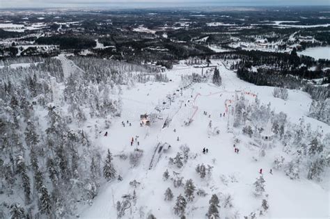 Skiing People On Top Of Vuokatti Slopes Ski Resort In Vuokatti Finland