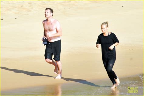 Shirtless Sam Worthington Lara Bingle Beach Kissing Couple Photo