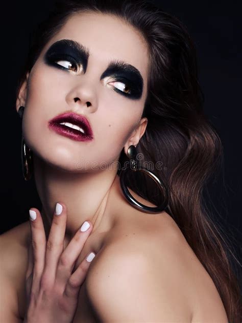 Beautiful Woman With Dark Hair And Extravagant Black Smokey Eyes Makeup Stock Image Image Of
